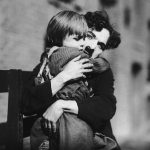 Charlie Chaplin hugging The Kid