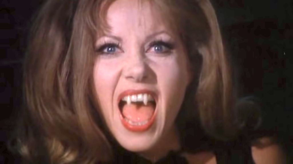 Ingrid Pitt about to put the bite on someone in "The Cloak"