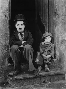 Charlie Chaplin and Jackie Coogan in an iconic photo from The Kid