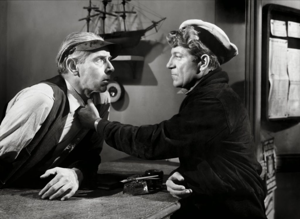 Bobo (Jean Gabin) intimidating someone while looking for Tiny