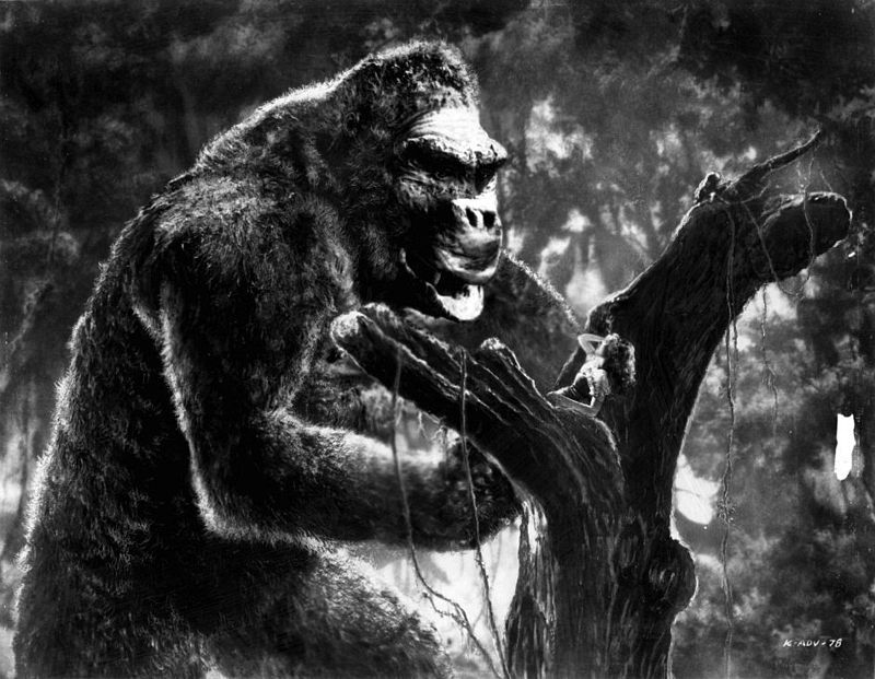 King Kong stores Fay Wray on a tree while he prepares to fight