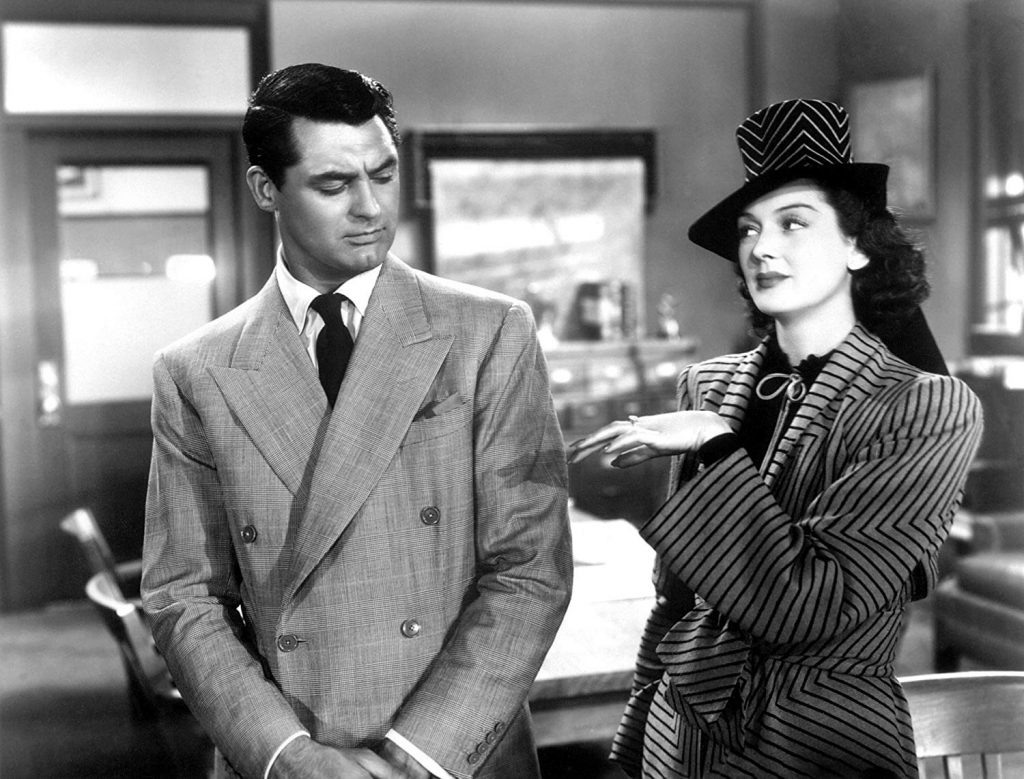 Cary Grant takes a look at the engagement ring that his ex-wife Rosalind Russell has in His Girl Friday