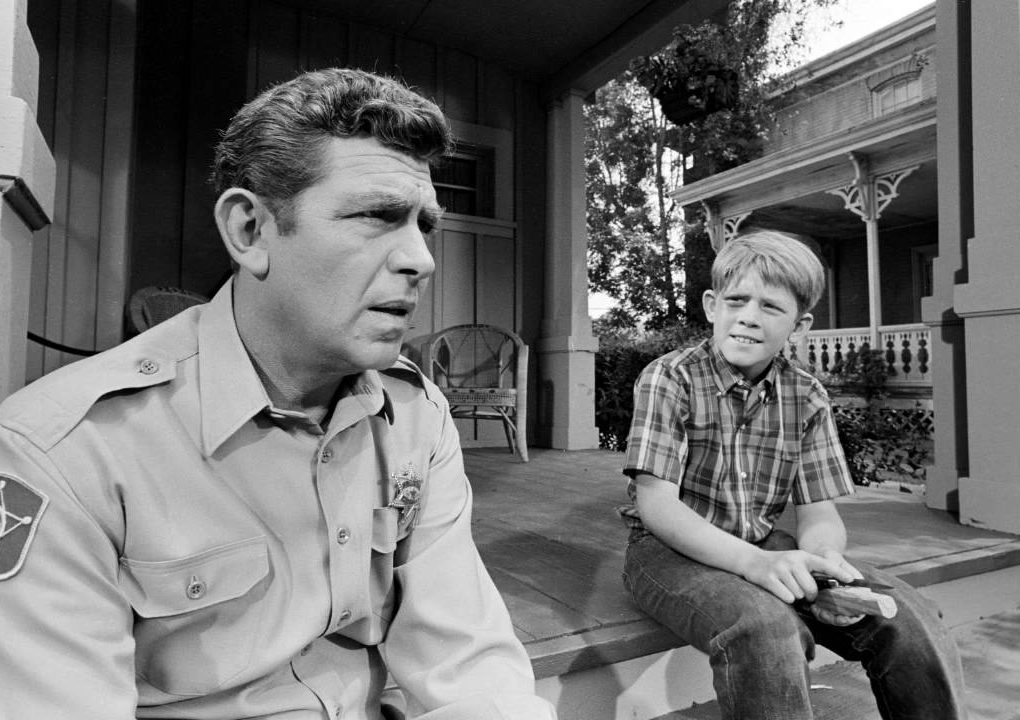 Andy Taylor talking with his son Opie about The New Housekeeper