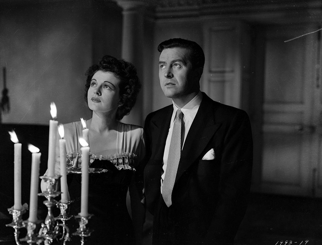 Ruth Hussey and Ray Milland in The Uninvited