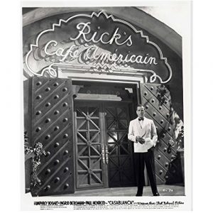 Humphrey Bogart as Rick, standing in front of Rick's Cafe Americain in Casablanca