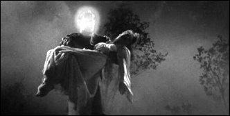 An electrified Lon Chaney Jr. carries an unconscious Anne Nagel in Man Made Monster