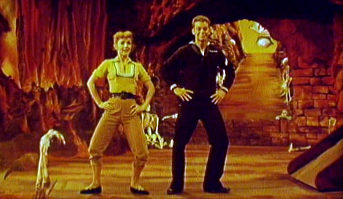 Debbie Reynolds and Russ Tamblyn in the fun house scene in Hit the Deck