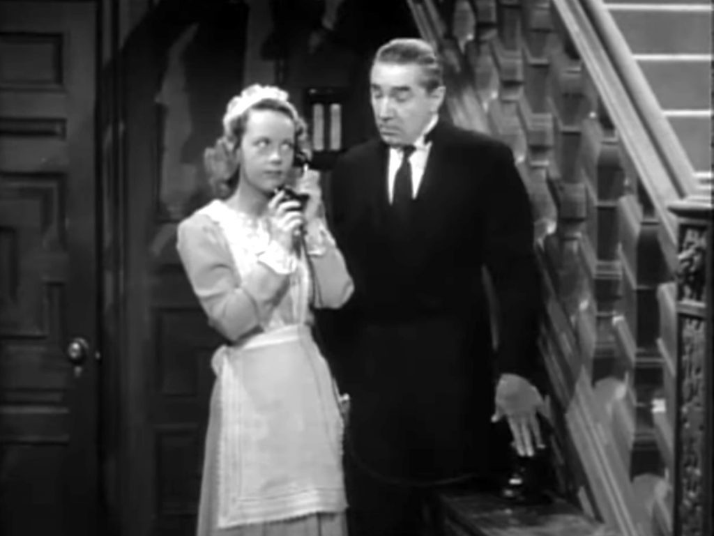 Janet Shaw as the maid, with Bela Lugosi as the butler who doesn't want her to make that phone call in Night Monster.