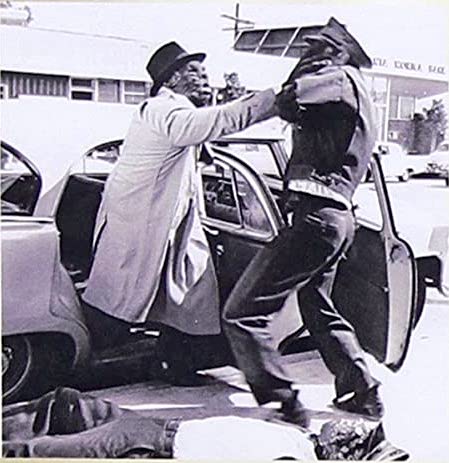 Out of that cab! Which the taxi driver quickly regrets