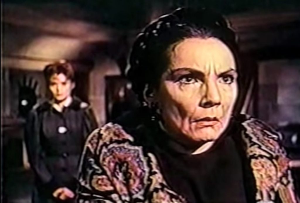 Freda Jackson as Greta, the Meinster family servant, insanely loyal to the vampiric Baron