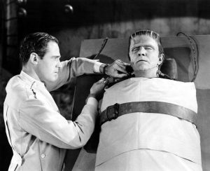 Patric Knowles as the scientist attempting to revive Frankenstein's monster (Bela Lugosi) in Frankenstein Meets the Wolf Man