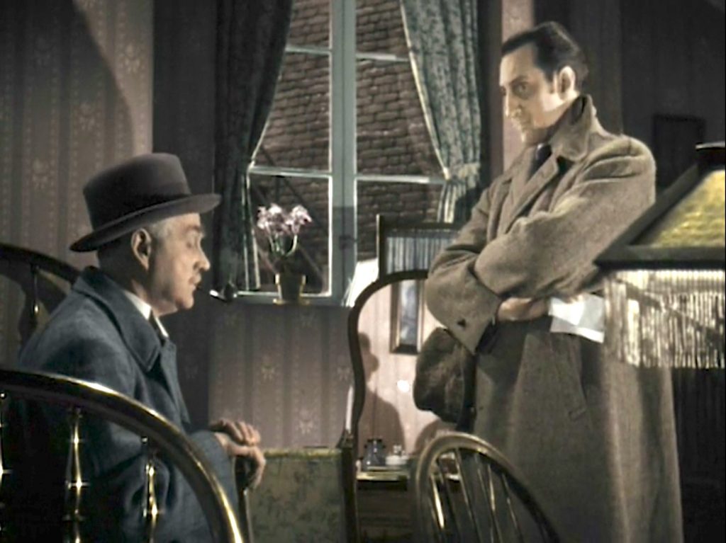 Dr. Watson and Sherlock Holmes investigating the scene of the most recent murder in The Woman in Green