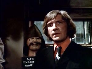 David Warner tries to cheat the proprietor in "Peter Cushing as the proprietor of the Temptations antique shop in "From Beyond the Grave"