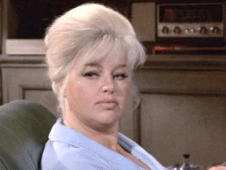 Diana Dors as the sheepish wife in "From Beyond the Grave"
