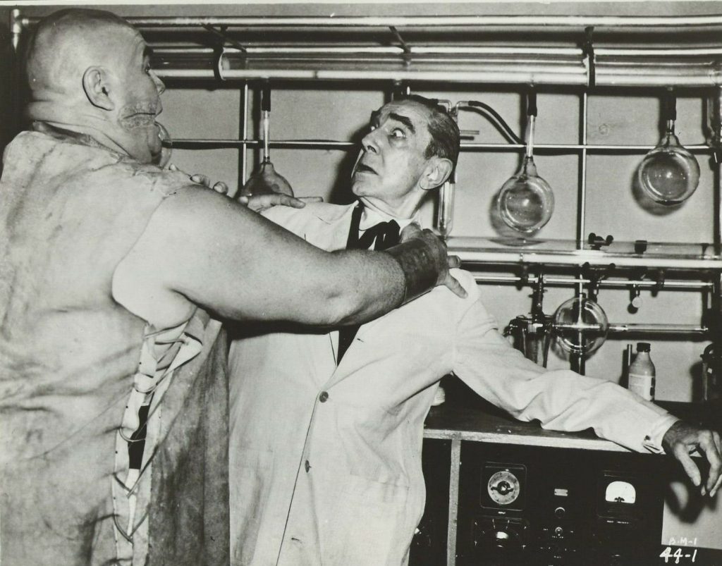 Lobo (Tor Johnson) attacks the mad scientist Dr. Vornoff (Bela Lugosi) in Bride of the Monster