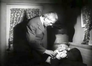 Dr. Niemann (Boris Karloff) threatening in House of Frankenstein