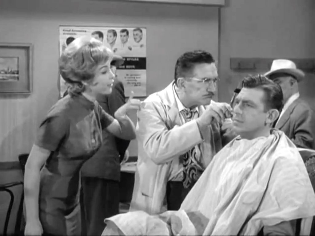 Ellen (Barbara Eden) enters Floyd's barbershop while Andy's getting a haircut