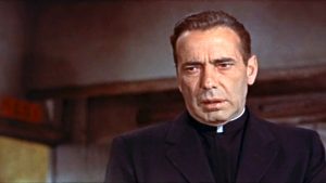 Humphrey Bogart as a Catholic priest in "The Left Hand of God"