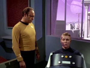 Crippled Captain Pike at Mr. Spock's court-martial in "The Menagerie, Part 1"