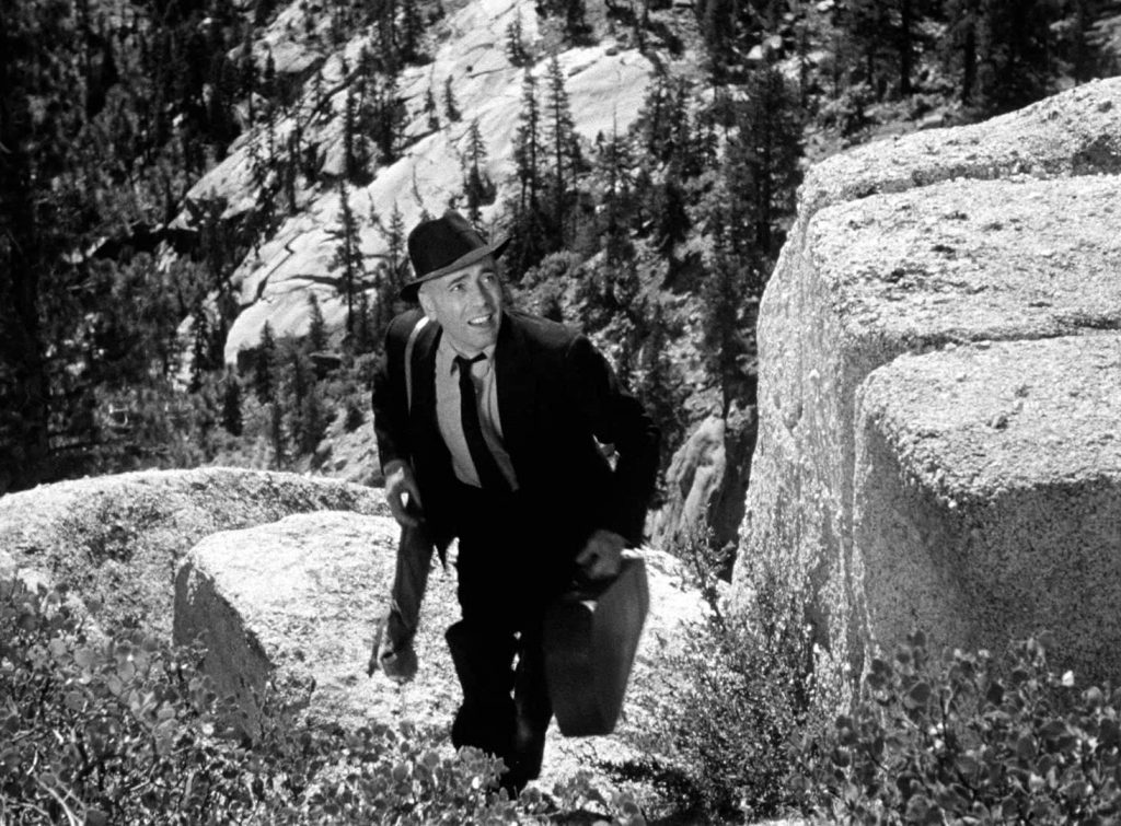 Humphrey Bogart as Mad Dog Roy Earle, trying to hide from the police in the mountains