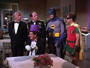 At The Penguin's Nest restaurant, the Penguin plans perfidy, while Batman, Robin, Commissioner Gordon oppose him