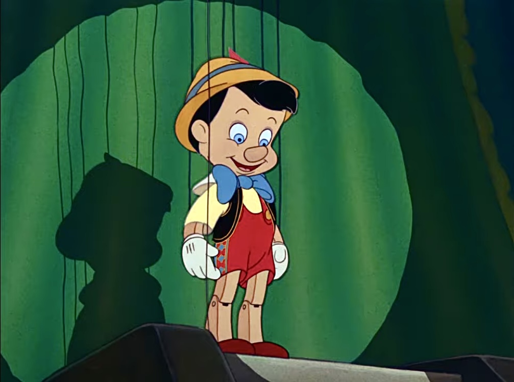 Pinocchio about to put on a show & sing "I've Got No strings on me"
