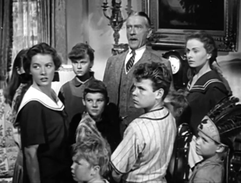 Clifton Webb with the children in "Cheaper by the Dozen"