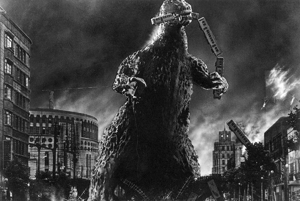 Iconic image of Gojira eating a train