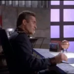 Commander Sinclair at his desk before his kidnapping in "And the Sky Full of Stars"