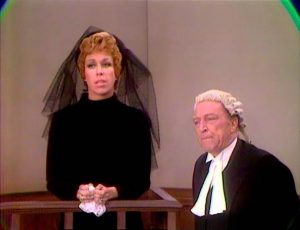 Carol Burnett as the grieving widow, testifying in court about the untimely death of her husband