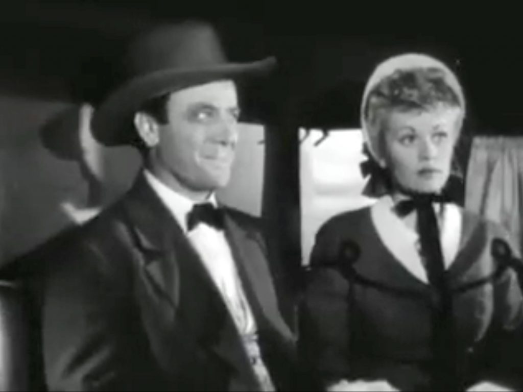 Sawyer (Dean Jagger) with a black eye and Christine (Lucille Ball) in a stagecoach heading to Tucson to get married in "Valley of the Sun"