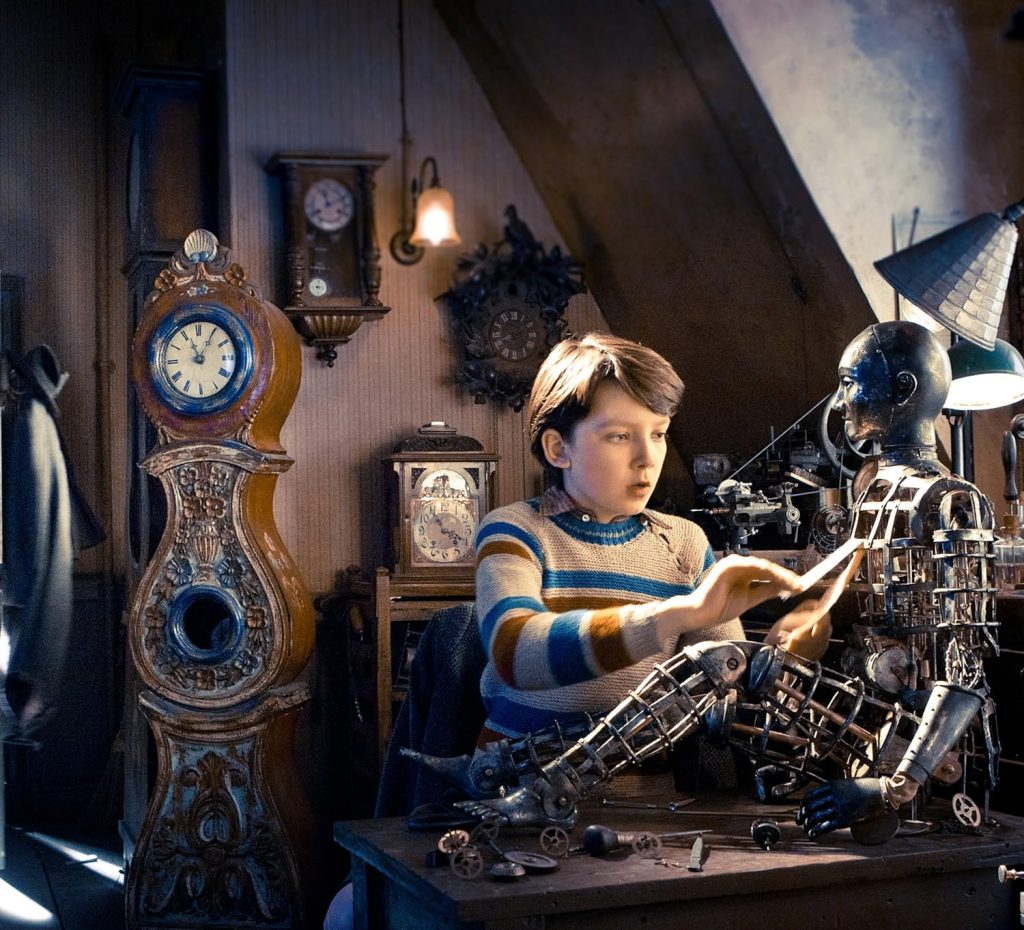 Hugo repairing the automaton that hiss father rescued from the museum