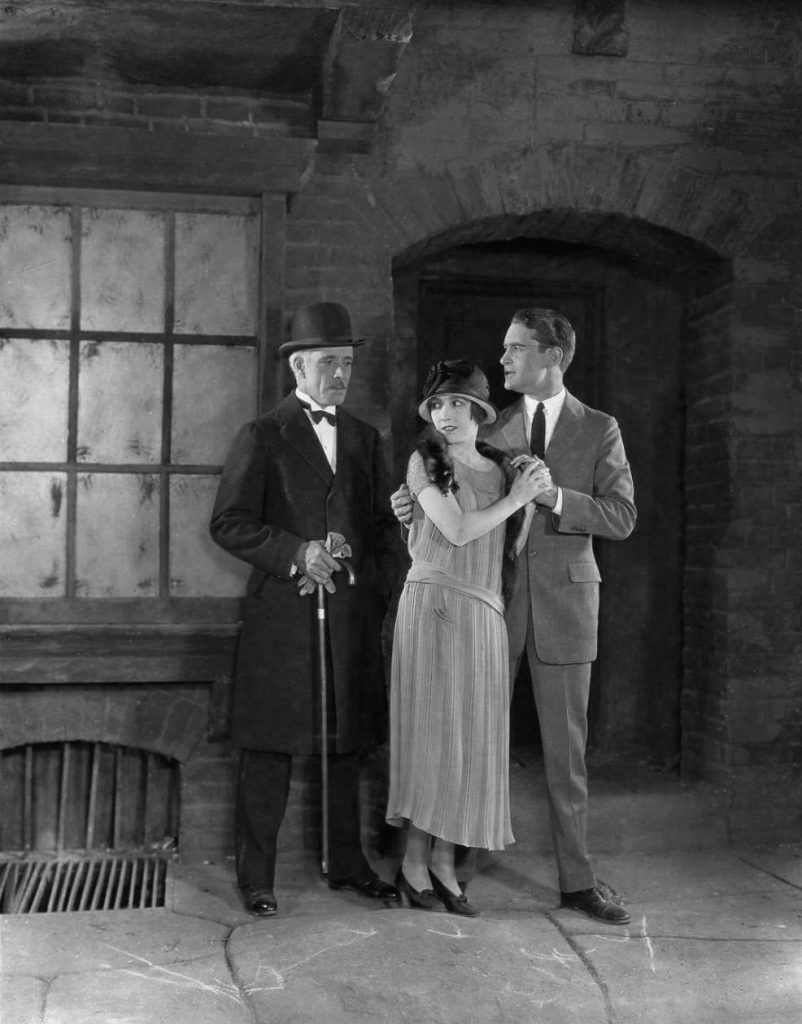 The love triangle in The Lost World 1925, where Sir John Roxton (Lewis Stone) is in love with Paula White (Bessie Love), but she's fallen in love with reporter Ed Malone (Lloyd Hughes)