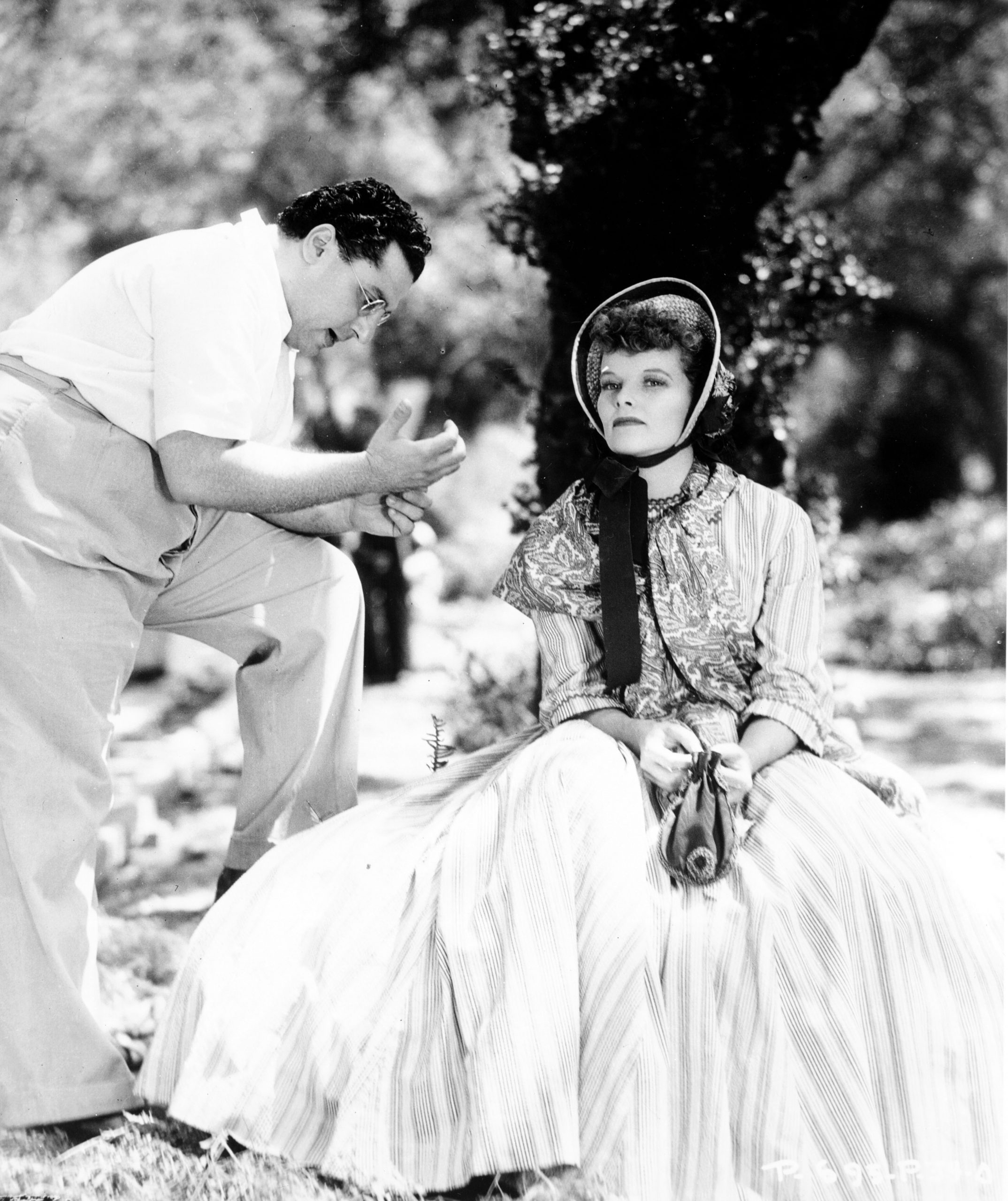 George Cukor provides direction to Katharine Hepburn during filming of LITTLE WOMEN (1933) 