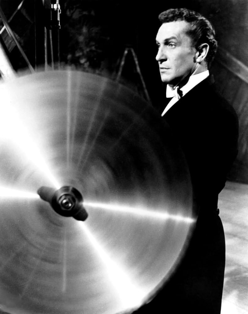 Vincent Price demonstrating the buzz saw illusion in "The Mad Magician"