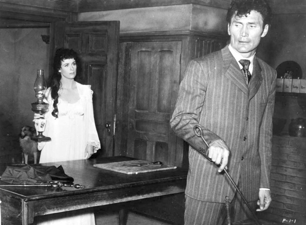 Constance Smith and Jack Palance in Man in the Attic
